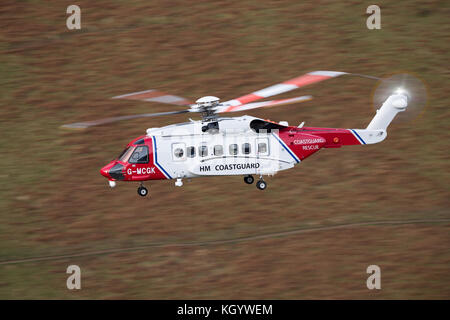 HM Coastguard Search & Rescue Helicopter Rescue 936, conducting low flying training in Snowdonia. Stock Photo