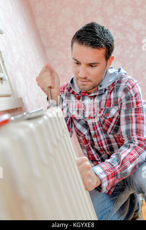 Fixing a leaky radiator Stock Photo - Alamy