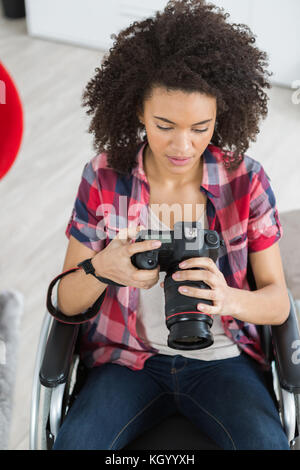 woman using a camera Stock Photo