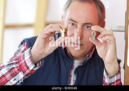 man holding a padlocks Stock Photo