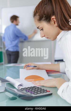 student girl with notebook and calculator in college Stock Photo