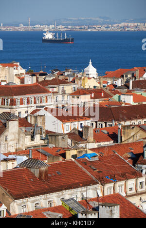 The residential houses of Alfama with Tejo river on the background as seen from the observation platform of Santa Justa Lift. Lisbon. Portugal Stock Photo