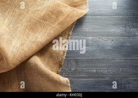 burlap hessian sacking on wooden background Stock Photo