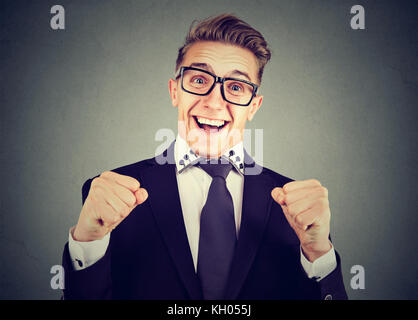Happy excited young man in glasses Stock Photo