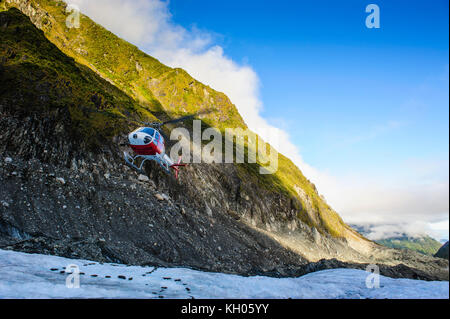 Helicopter transporting tourists into Fox Glacier, South Island, New Zealand Stock Photo