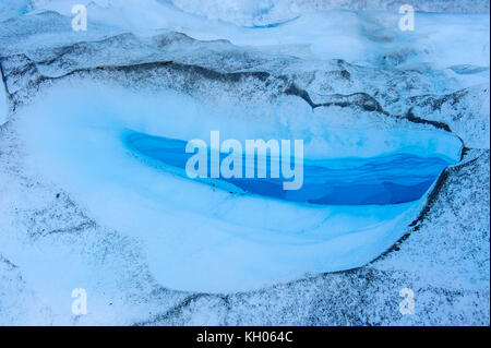 Huge hole in the ice of the Fox Glacier, South Island, New Zealand Stock Photo