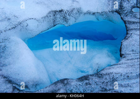 Huge hole in the ice of the Fox Glacier, South Island, New Zealand Stock Photo