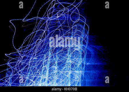 wires of blue lights like sparks caused by an electric shock following a short circuit Stock Photo