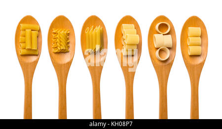 Pasta food selection in oak wood spoons over white background. Stock Photo