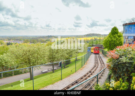 WINDSOR, BERKSHIRE. ENGLAND UK- APRIL 20 2016 : Legoland resort. People enjoying one of the many rides at Legoland Theme park.Train gives tour. Stock Photo