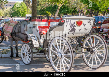 Corfu, Greece - April 15, 2017: Easter time and Corfu floods from people at every corner. Beautifully decorated carriage. Stock Photo