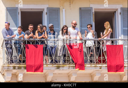 Corfu, Greece - April 15, 2017: Every Holly Saturday at 11 a.m. people in the old town of Corfu start gathering to spectate the pot throwing event . Stock Photo