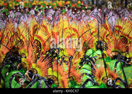 Thousands of participants dance to the rhythm of carnival beats during the samba school Grande Rio’s colourful parade at the Sambodromo at the Rio Carnival 2014. Brazil 03.03.2014. Stock Photo