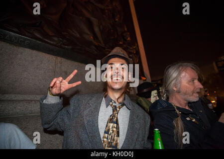 The protester known as “Danny” is back on ground after a 28-hour stand-off with the police perched on the Winston Churchill statue in Parliament Square on October 23. UK, 05/11 2014. Stock Photo