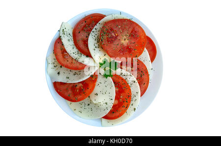Caprese salad with ripe tomatoes and mozzarella cheese on white background Stock Photo