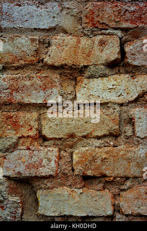 Closeup detail photograph of a crumbling brick wall. Stock Photo