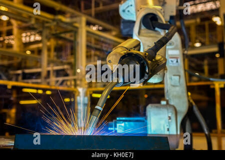 Industrial robot is test run new program welding in factory Stock Photo