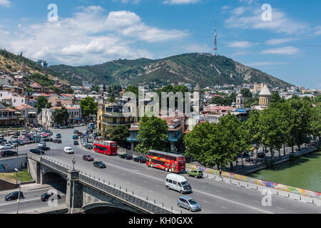 Tbilisi, Georgia, Eastern Europe - view across the Mtkvari River and the Old Town district of the city towards the Tbilisi TV Tower and Mtatsminda. Stock Photo