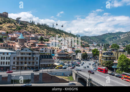 Tbilisi, Georgia, Eastern Europe - view across the Mtkvari River and the Old Town district of the city towards the Tbilisi TV Tower and Mtatsminda. Stock Photo