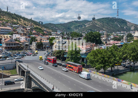 Tbilisi, Georgia, Eastern Europe - view across the Mtkvari River and the Old Town district of the city towards the Tbilisi TV Tower and Mtatsminda. Stock Photo