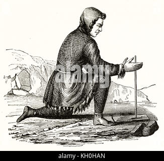 Old illustration of a Kamchatka dweller fire making. By unidentified author, publ. on Magasin Pittoresque, Paris, 1847 Stock Photo