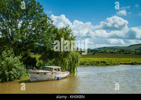 Boat moored on river Arun in West Sussex, England. Stock Photo