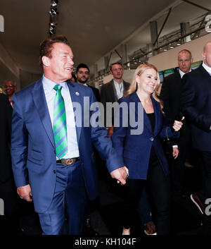 Bonn, Germany. 12th Nov, 2017. Arnold Schwarzenegger, R20 Founding Chair and Governor of California with his girlfriend Heather Milligan at the COP23 Fiji conference in Bonn, Germany on the 12th of November 2017. COP23 if organized by UN Framework Convention for Climate Change. Fiji holds presidency over this meeting in Bonn. Credit: Dominika Zarzycka/Alamy Live News Stock Photo