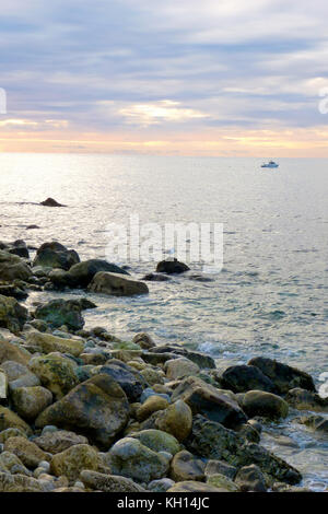 Chesil Beach, UK. 13th Nov, 2017. UK Weather. People make the most of the calm, sunny weather along Chesil beach, Isle of Portland Credit: stuart fretwell/Alamy Live News Stock Photo