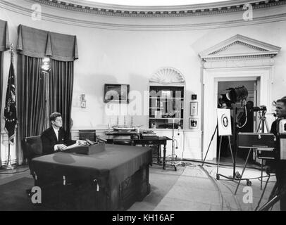 President John F. Kennedy prepares to address the nation from the Oval Office via television regarding the admission of the first African-American student, James Meredith, to the University of Mississippi or Ole Miss, Washington, DC, Sept 30, 1962. Photo by Abbie Rowe. Stock Photo