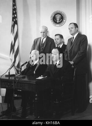 Democratic Leaders  of the 87th Congress pose under the Presidential Seal; seated l-r: Sam Rayburn, Speaker of the House; Mike Mansfield, Senate Majority Leader; standing l-r: John W McCormack, House Majority Leader; Carl B Albert, House Majority Whip; and Hubert Humphrey, Senate Majority Whip, Washington, DC, March 21, 1961. Photo by Abbie Rowe