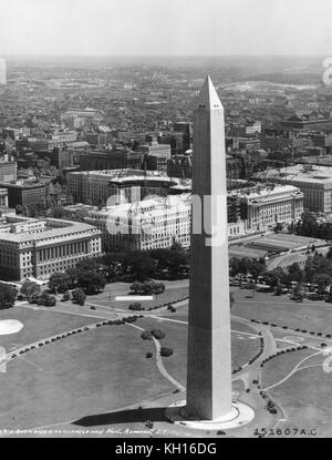 Vertical photo of the Washington Monument with the Commerce Department in the background, as taken from a US Army Air Corps aircraft, Washington, DC, 1933. Photo by US Army Air Corps Stock Photo