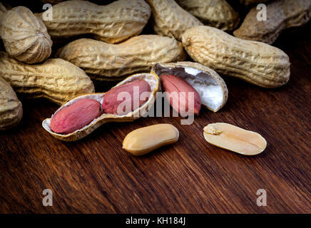 Peanuts in shells on vintage wooden background Stock Photo