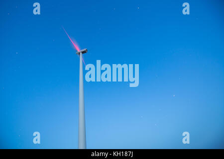 Windmill against night sky with stars, copyspace Stock Photo