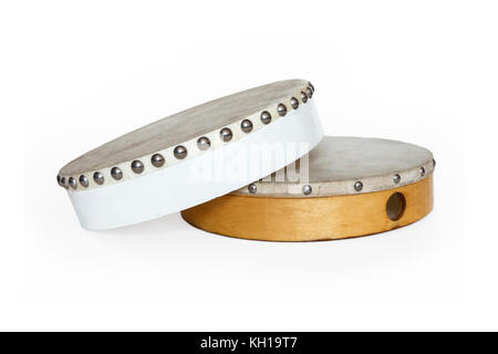Two traditional tambour drums, one white one natural wood colour, against a white background Stock Photo