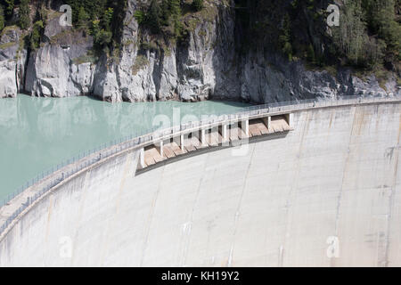 GIBIDUM DAM, NATERS, SWITZERLAND - September 22, 2017: View on the upper part of the hydroelectric power dam showing its spillways. Stock Photo