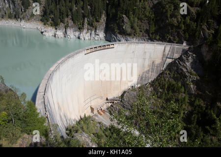 GIBIDUM DAM, NATERS, SWITZERLAND - September 22, 2017: High angle view on the large hydroelectric Gibidum dam in the mountains of Wallis. Stock Photo