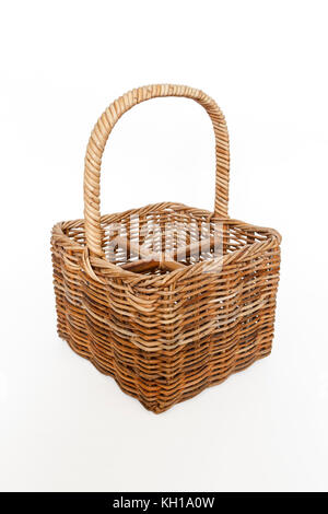An empty wicker wine basket against a white background Stock Photo