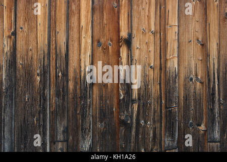 Vertical weathered old wood planks with a gradient from dark to light. Stock Photo