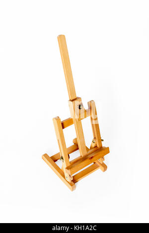 An artist's small table easel isolated against a white background Stock Photo