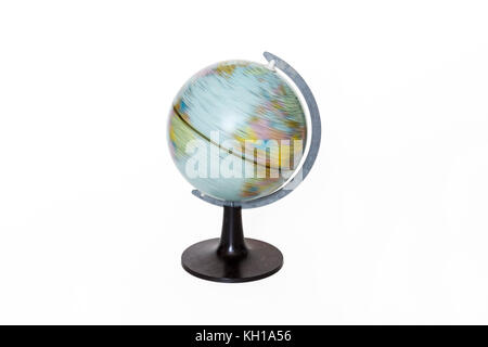 A small spinning globe on a white background Stock Photo