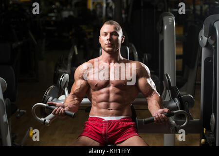 Muscular Fitness Bodybuilder Doing Heavy Weight Exercise For