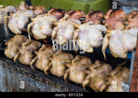 selling grilled/roasted chicken at the fresh market (pasar tani) located in Kelana Jaya,Petaling jaya,selangor,malaysia Stock Photo