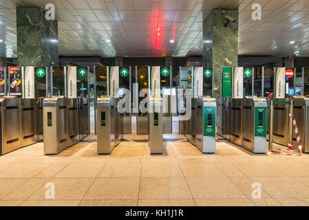 Milan, Italy - February 17, 2017: station of Cadorna, turnstile or ticket barrier of access to trains. Italian company Trenord Stock Photo