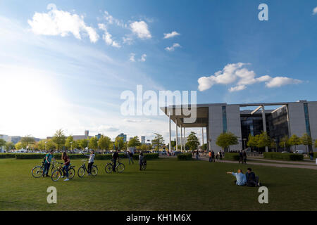 People relaxing and having fun in a public park, next to the 'Paul-Löbe haus', a government office in Berlin Stock Photo