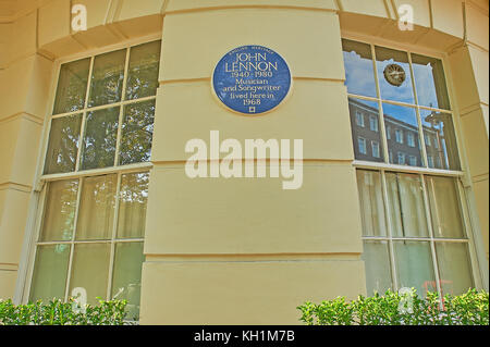 Circular blue plaque on a building façade in London highlighting John Lennon lived in the building for a short period Stock Photo