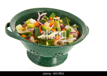 Mixed raw vegetables in frying pan isolated over white background Stock Photo