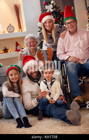 family, holidays, generation, Christmas and people concept - family spending Christmas time Stock Photo