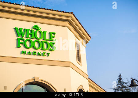 September 2, 2017 Santa Clara/CA/USA - The Whole Foods supermarket logo above the store entrance in the sunset light Stock Photo