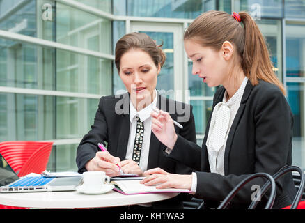 Two young business women Stock Photo