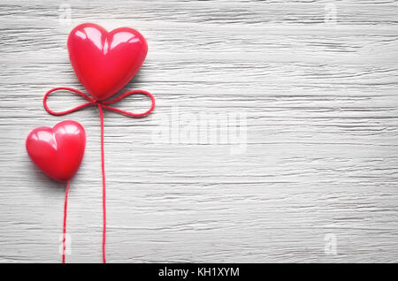 Two candy hearts for Valentine's Day with grey background. Stock Photo